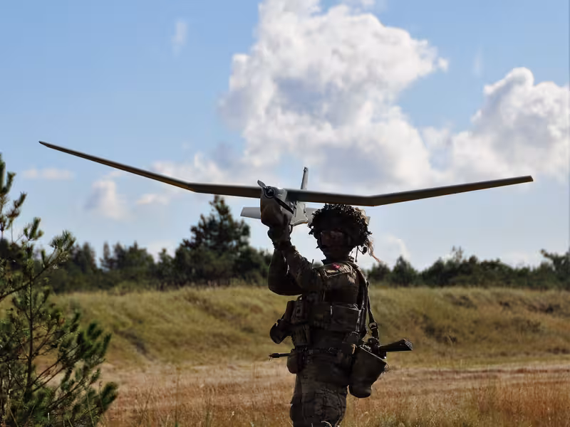 Drone operator launches fixed wing ISR drone.